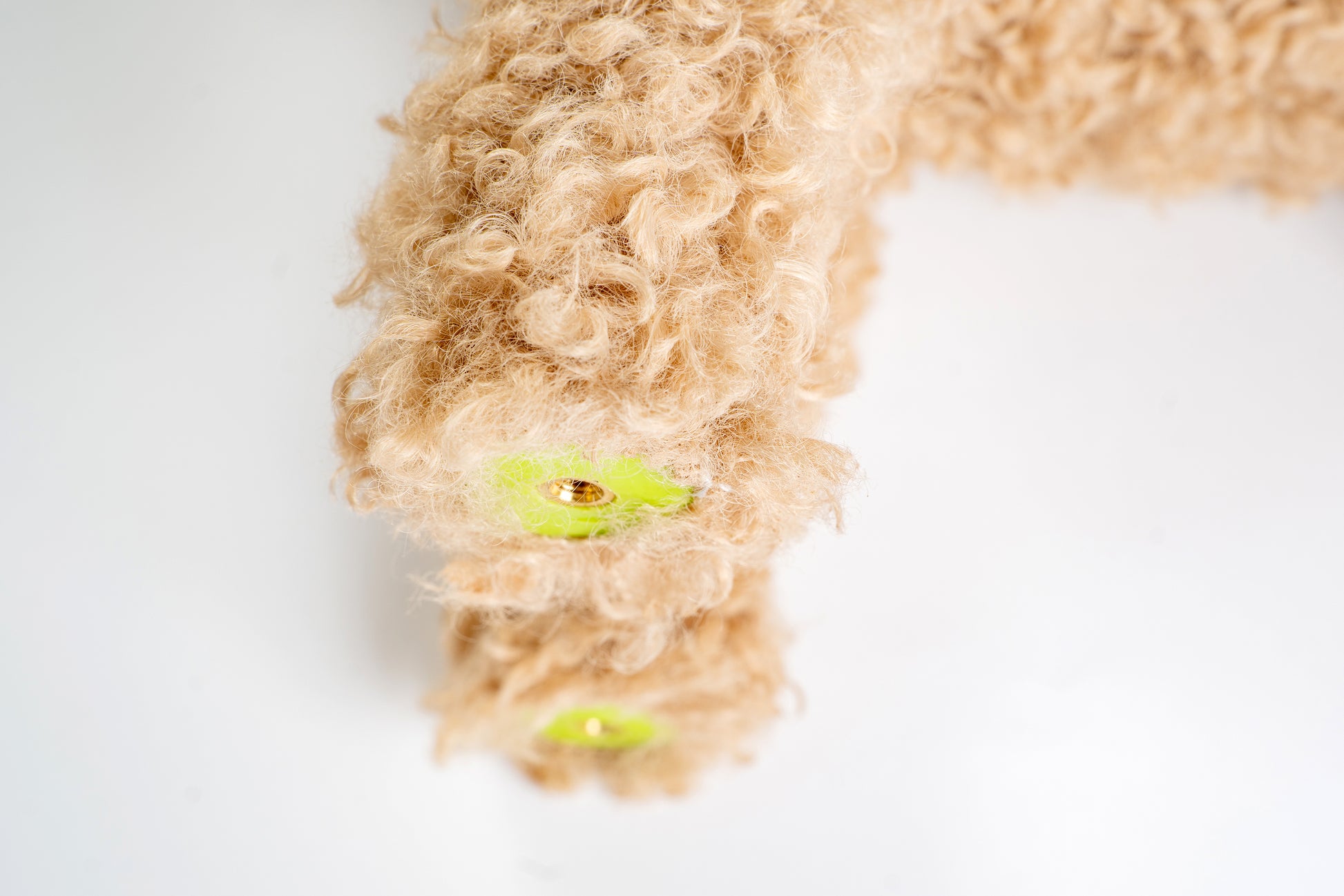 Beige dog stress relief accessory with adjustable legs in detail